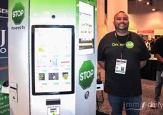 James Edwards of GreenStop, showing off their cannabis vending machine