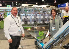 Jim Pryor and Lise Bernard of Green Vault Systems in front of the Precision Batcher, an automated solution to batch and package cannabis