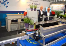 Paul Rademakers and Adrie van Diemen at Willburg Projecten, at the GreenTech presenting the newest variety of its well known pot washing machines. The width of the section where the pots are brushed clean is automatically adjusted to the pot size of the plant coming in.