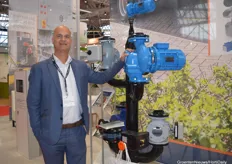 Arwin van der Wees of SPX Flow next to one of his own pumps at the booth of Zantingh.